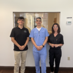 Members of our team- Alex, Genci, and Kristen from left to right in front desk area