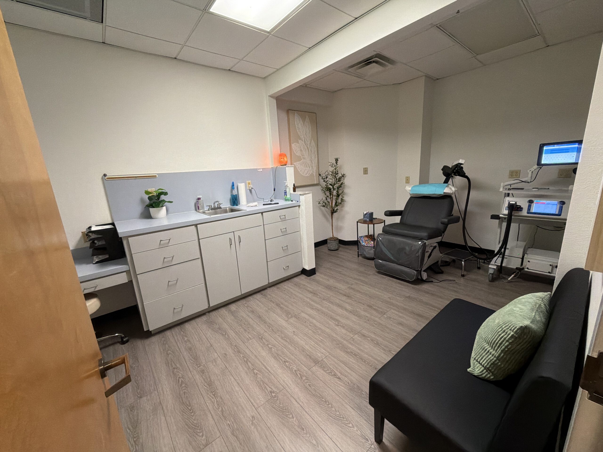TMS Therapy Room in office with machine and chair